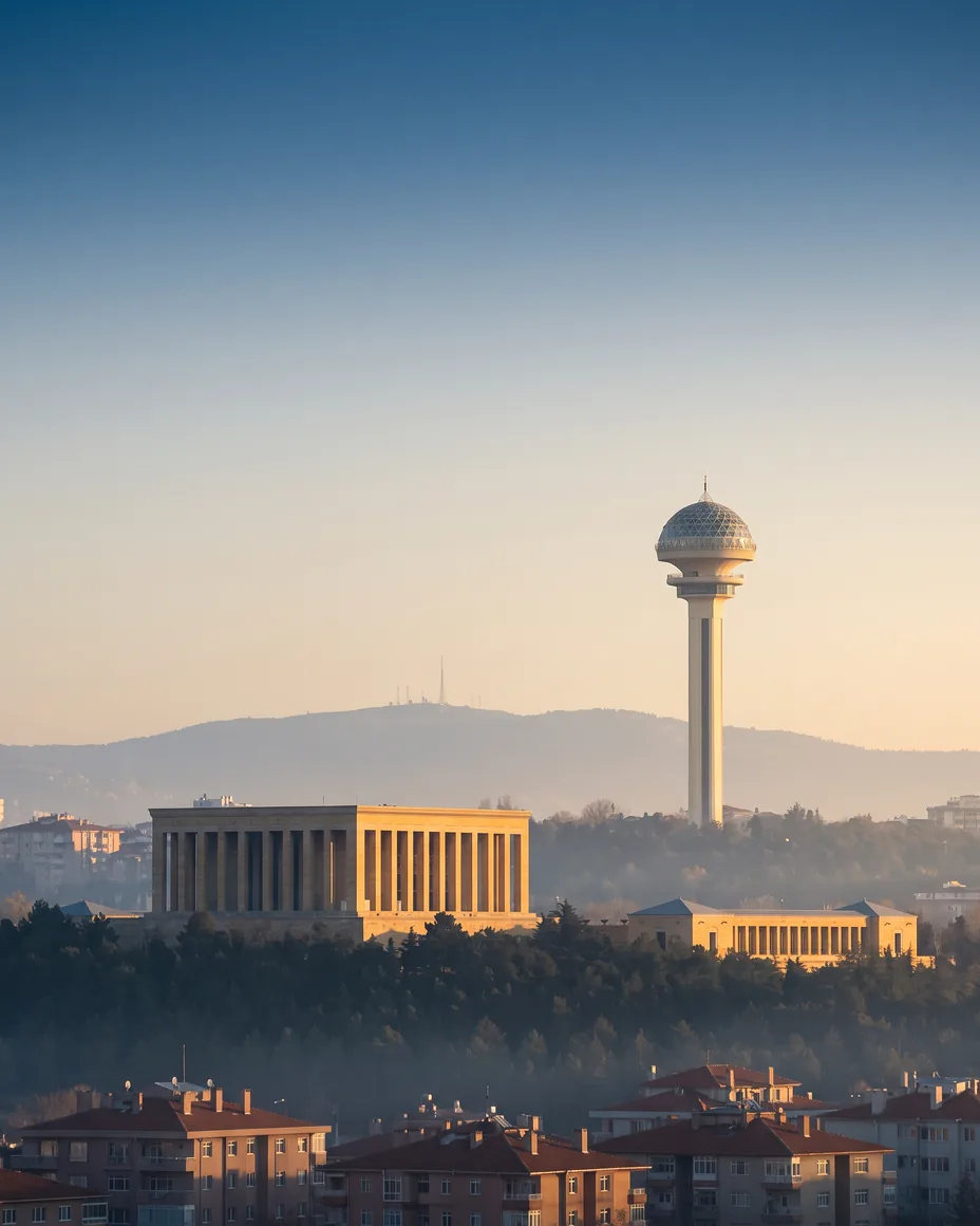Anıtkabir and Atakule at Golden Hour Golden-hour view of Ankara; Anıtkabir lit by the sun with Atakule tower in the haze behind.